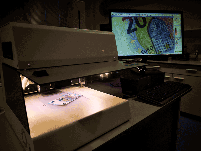 High-level magnification and lighting of a banknote.